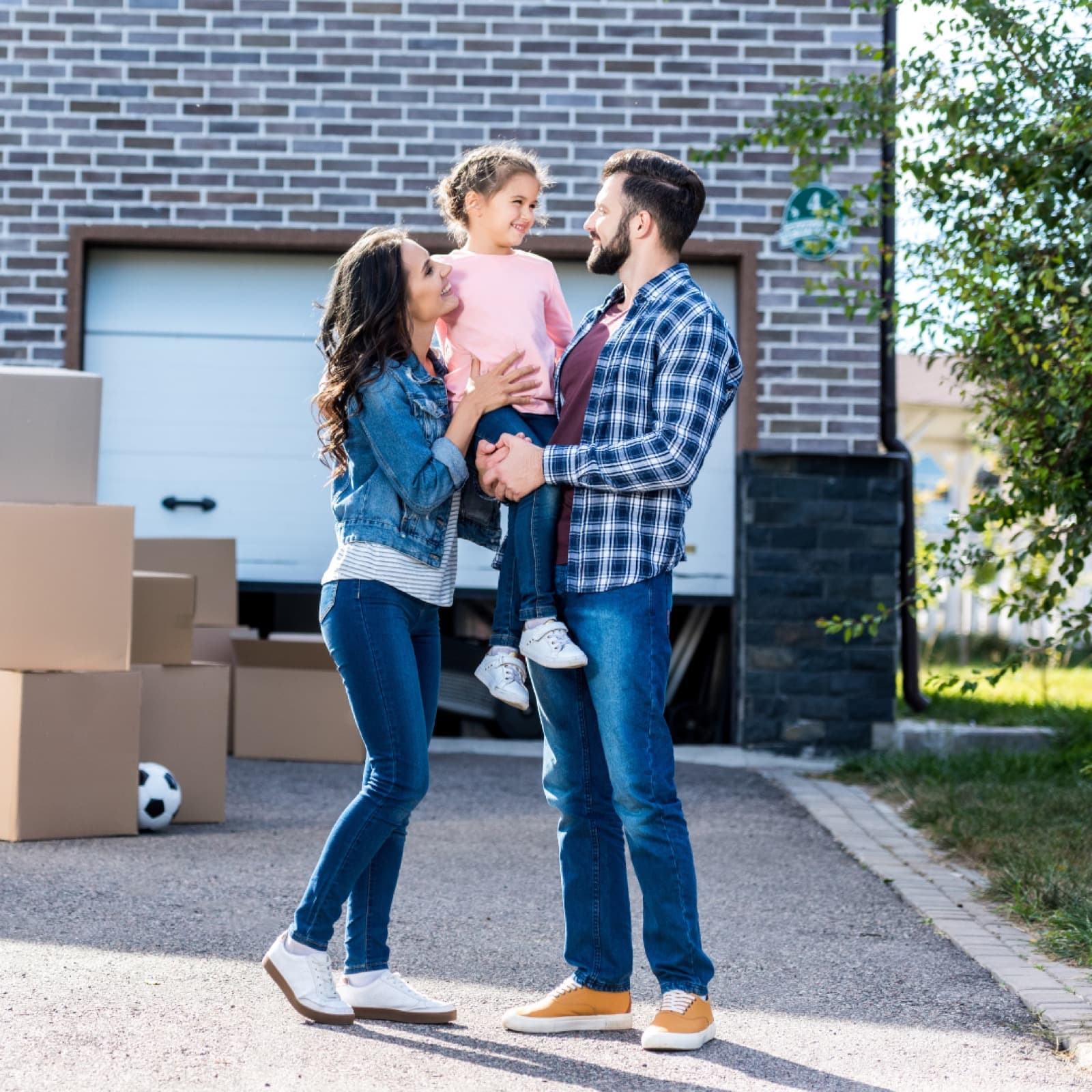 Family in front of the home they sold with confidence
