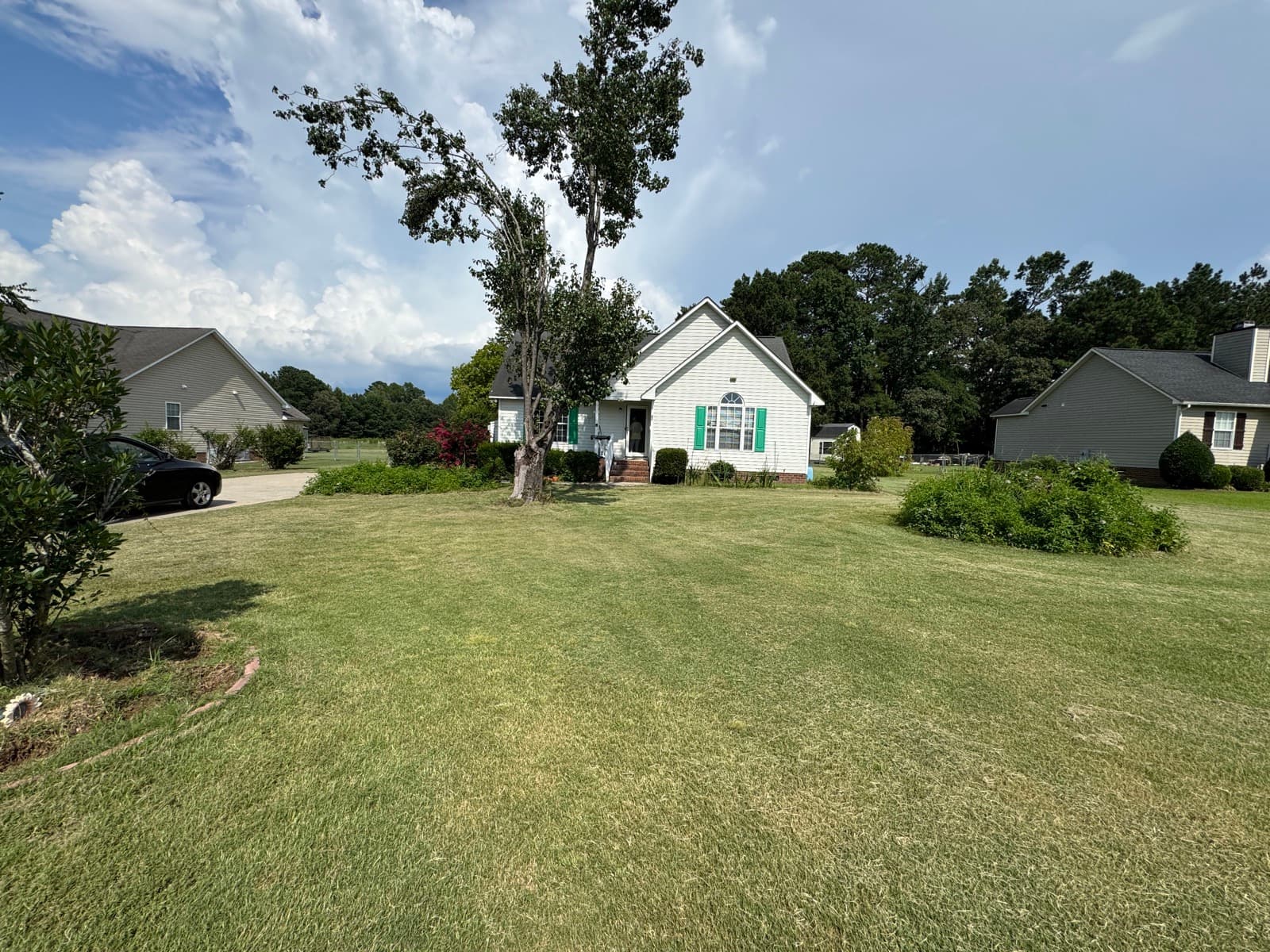 Raleigh NC home Atlantis Homebuyers bought 5 days before foreclosure auction, distressed exterior before rehab