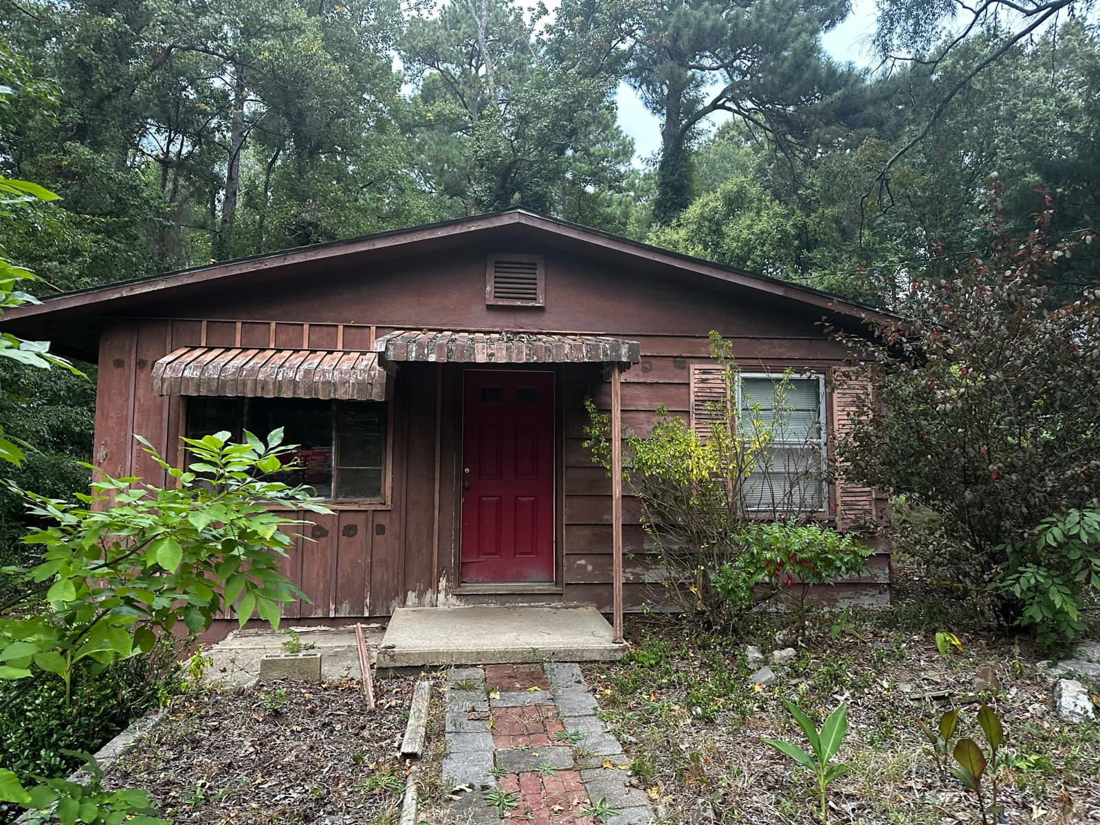 Distressed NC home with open code violations, bought as-is by Atlantis Homebuyers, fines and liens transferred at closing