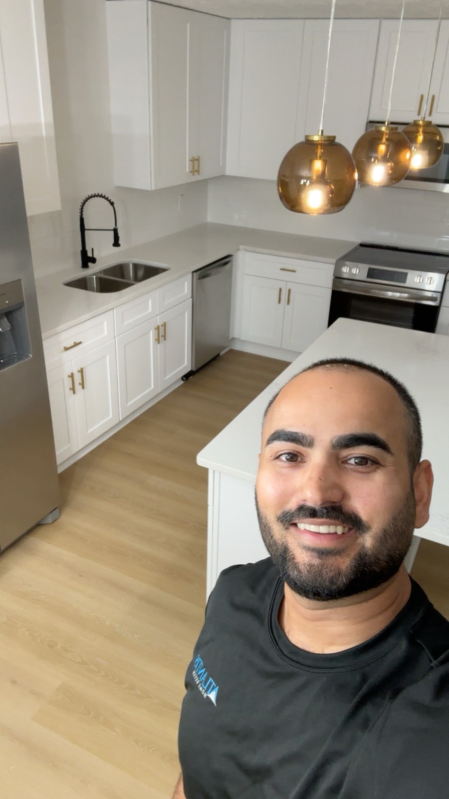 AJ Jamal founder of Atlantis Homebuyers walking a recently purchased NC rental property on-site after closing