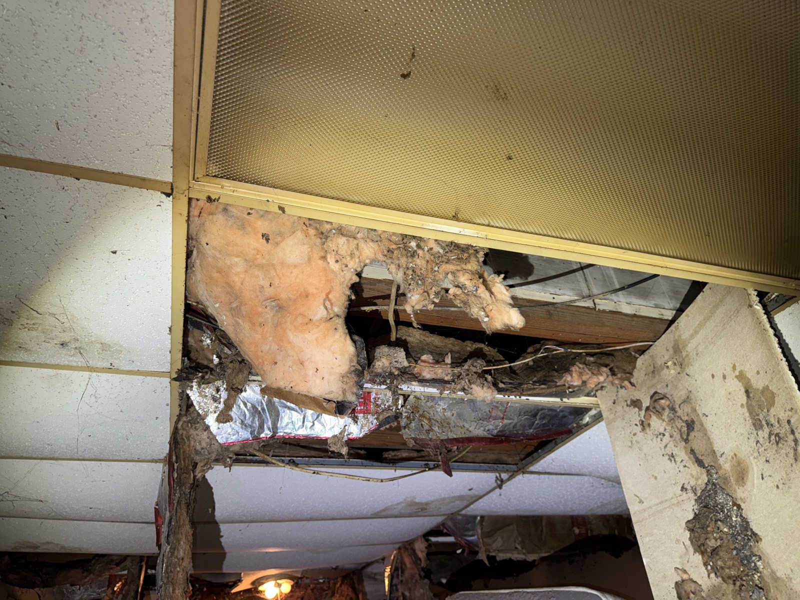 Deteriorating wood-paneled interior of an older NC home with water damage and deferred maintenance bought as-is by Atlantis Homebuyers